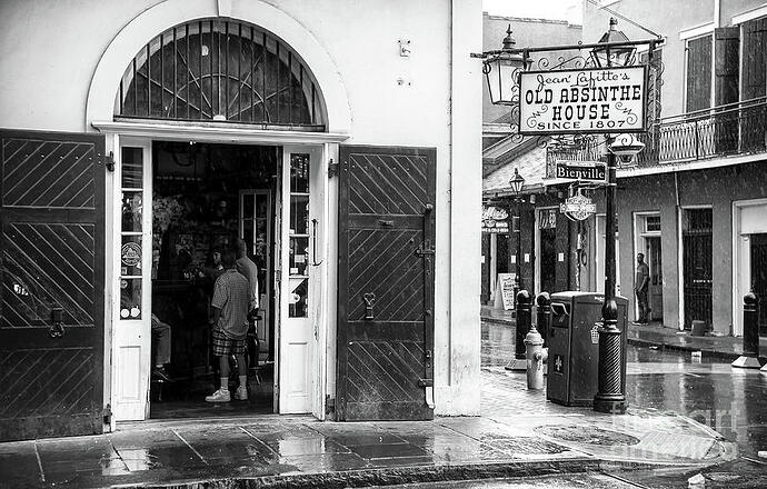 waiting-out-the-rain-at-the-old-absinthe-house-in-new-orleans-john-rizzuto