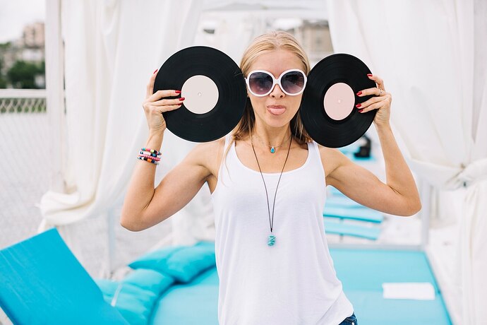 woman-with-vinyl-records-showing-tongue_23-2147670342